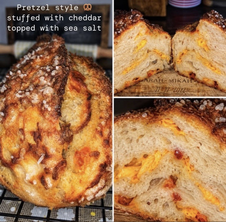 Pretzel style sourdough bread stuffed with cheddar cheese & topped with sea salt